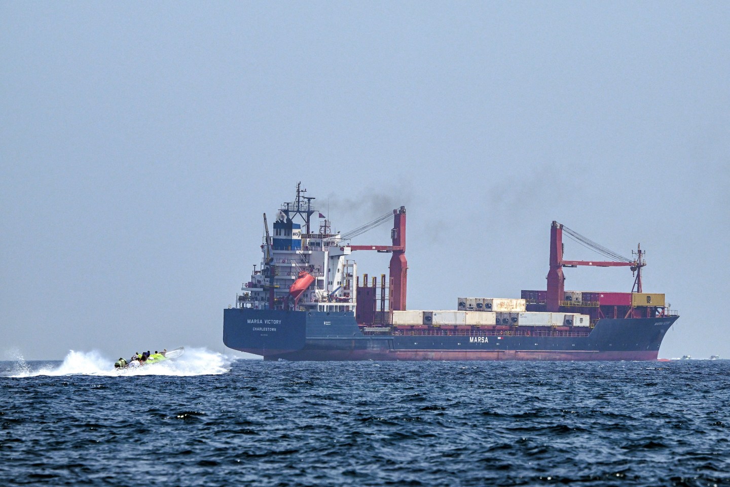 A container ship in the waters of the Strait of Hormuz off the coast of Khasab in Oman’s northern Musandam peninsula on June 25, 2025.
