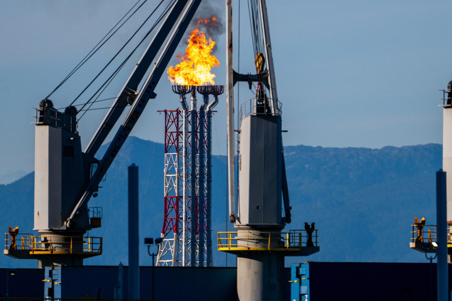 A flare stack at the LNG Canada facility in Kitimat, British Columbia, Canada, on Monday, July 14, 2025. LNG Canada, a joint venture between Shell, Petronas, PetroChina, Mitsubishi Corp. and Korea Gas, shipped its first liquefied natural gas cargo in June, a milestone almost seven years in the making. Photographer: James MacDonald/Bloomberg via Getty Images