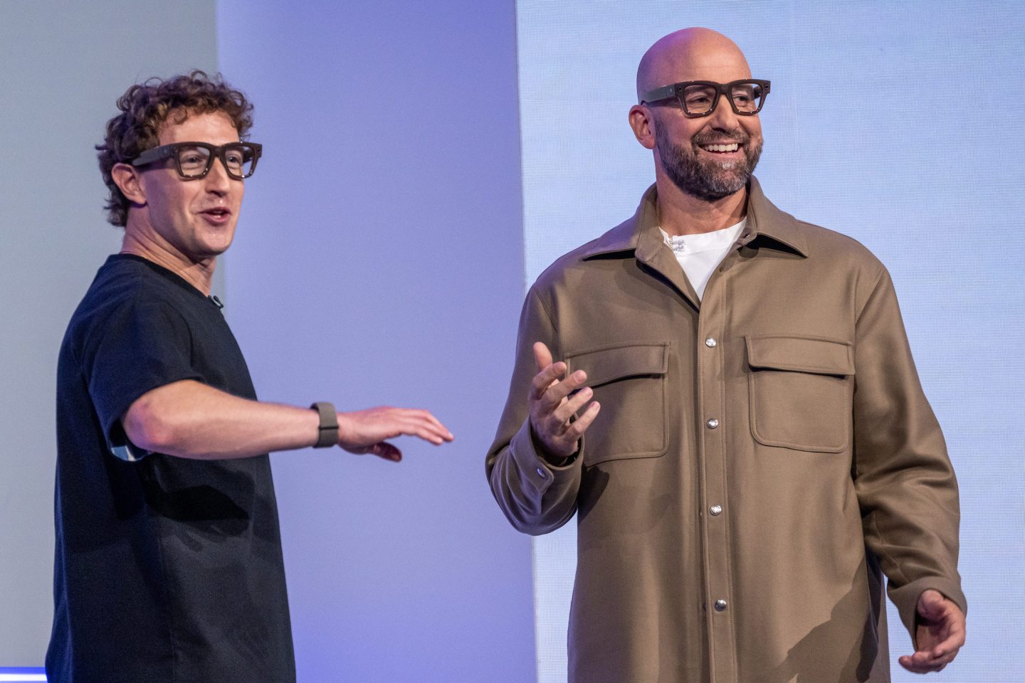 Mark Zuckerberg, chief executive officer of Meta Platforms Inc., left, and Andrew Bosworth, chief technology officer and head of Reality Labs, wear Meta Ray-Ban Display AI glasses during the Meta Connect event in Menlo Park, California, US, on Wednesday, Sept. 17, 2025. Meta Platforms, seeking to turn its burgeoning smart glasses into a must-have product unveiled its first version with a built-in screen. Photographer: David Paul Morris/Bloomberg via Getty Images