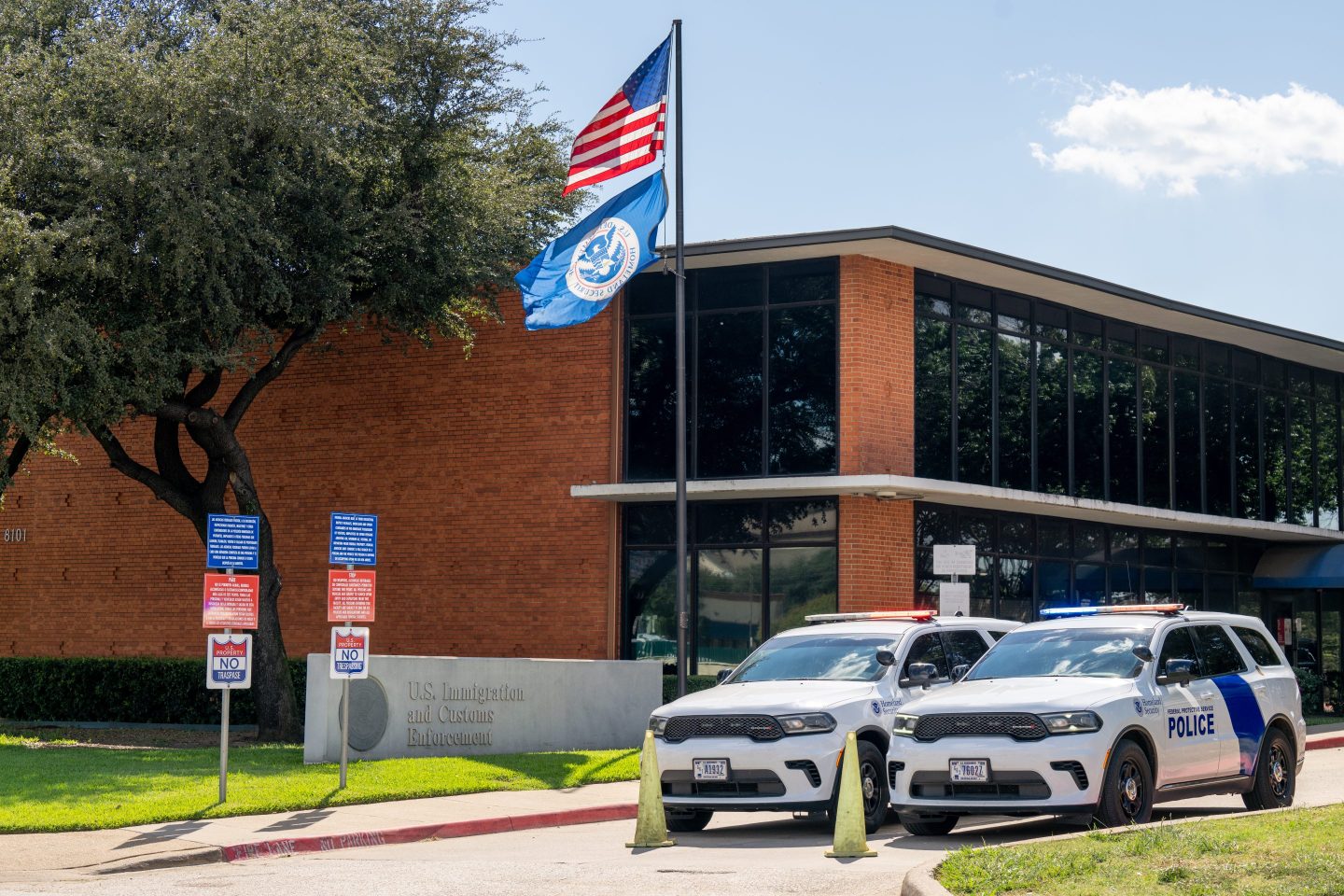 DALLAS, TEXAS - SEPTEMBER 25: Law enforcement vehicles are stationed at the entrance of a U.S. Immigration and Customs (ICE) detention facility following a shooting on September 25, 2025 in Dallas, Texas. A detainee was killed and two others were critically injured in a sniper attack on September 24th at the detention facility alongside Interstate 35. Reports have identified the gunman as 29-year-old Joshua Jahn, who was later found dead from a self-inflicted gun wound.  (Photo by Brandon Bell/Getty Images)