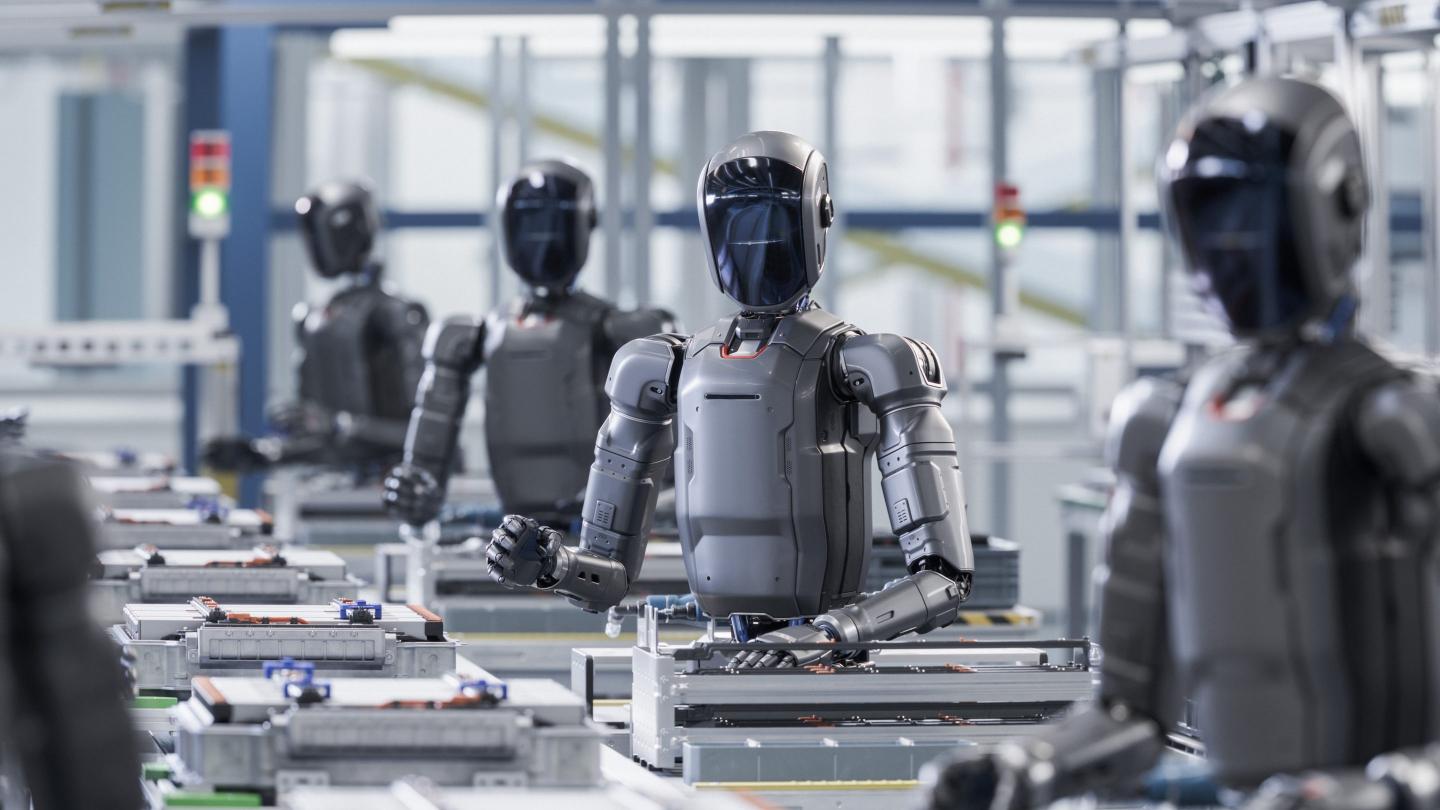 Faceless humanoid robots working on some kind of assembly line.