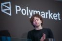 man photographed in front of polymarket sign