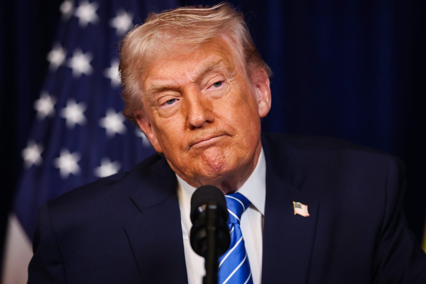 U.S. President Donald Trump listens during a press conference with Ukrainian President Volodymyr Zelensky following their meeting at Trump’s Mar-a-Lago club on December 28, 2025 in Palm Beach, Florida.