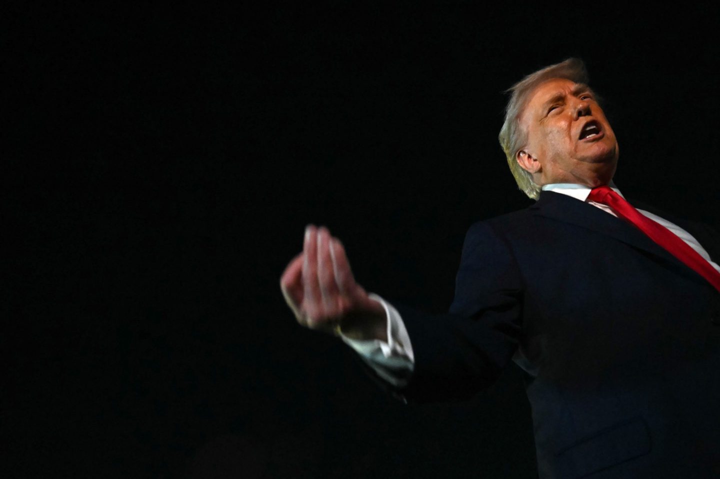 Trump yelling, camera looking up from an angle