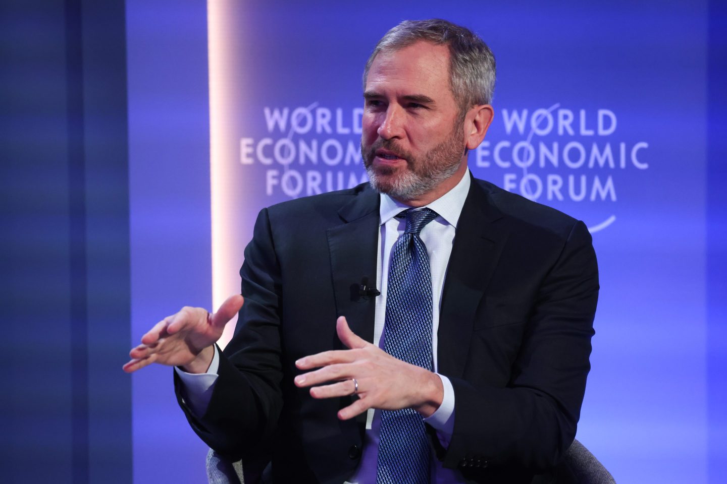 Man speaks on conference stage
