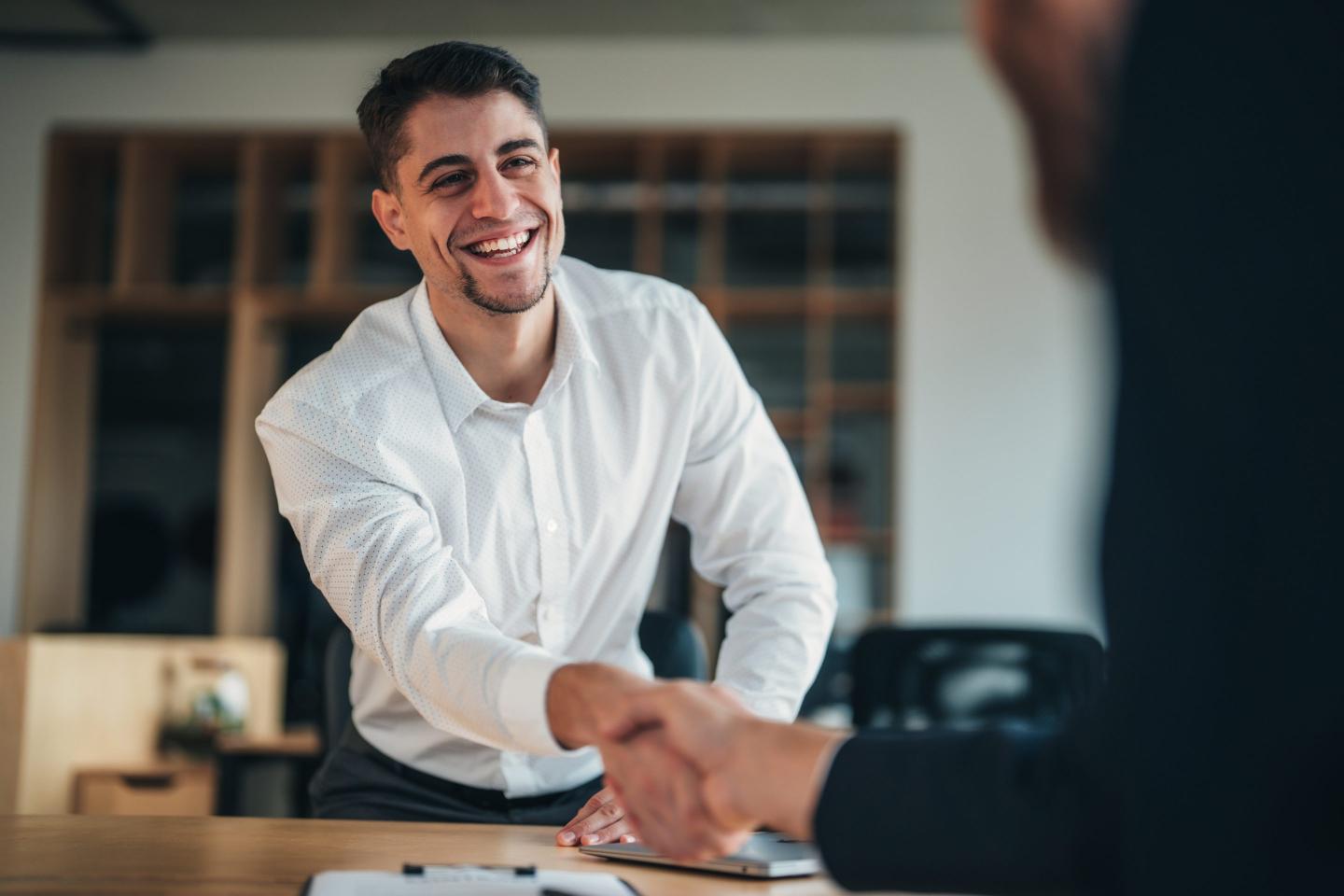 Business man shakes hand