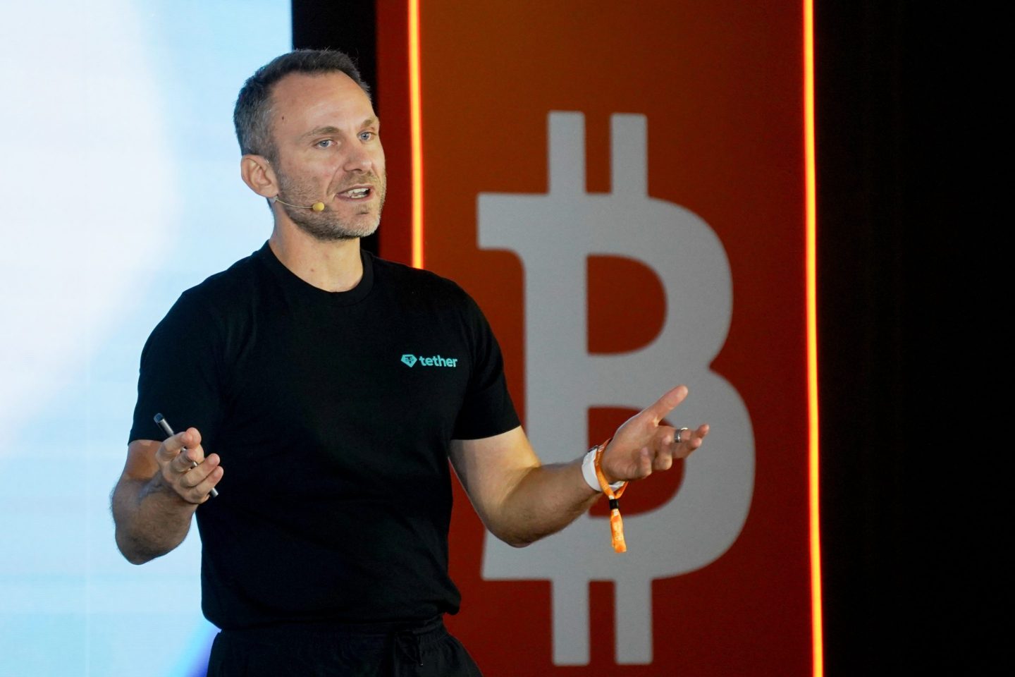 man speaks at conference