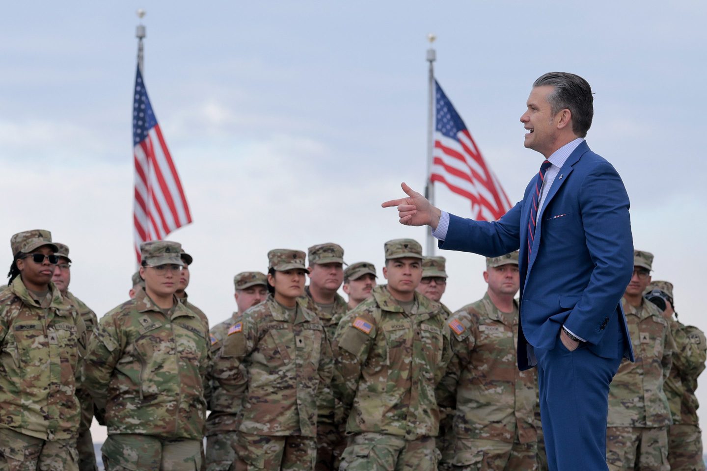 Pete Hegseth next to U.S. army troops
