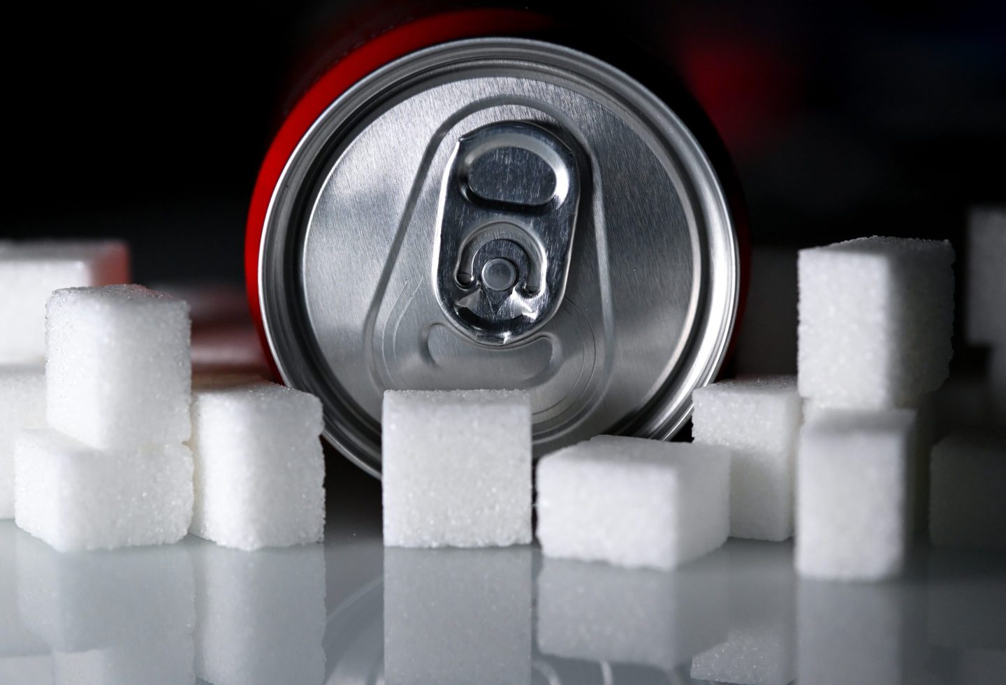 ILLUSTRATION - 17 February 2026, Bavaria, Munich: A beverage can with a soft drink and numerous sugar cubes lie on a table. Photo: Sven Hoppe/dpa (Photo by Sven Hoppe/picture alliance via Getty Images)