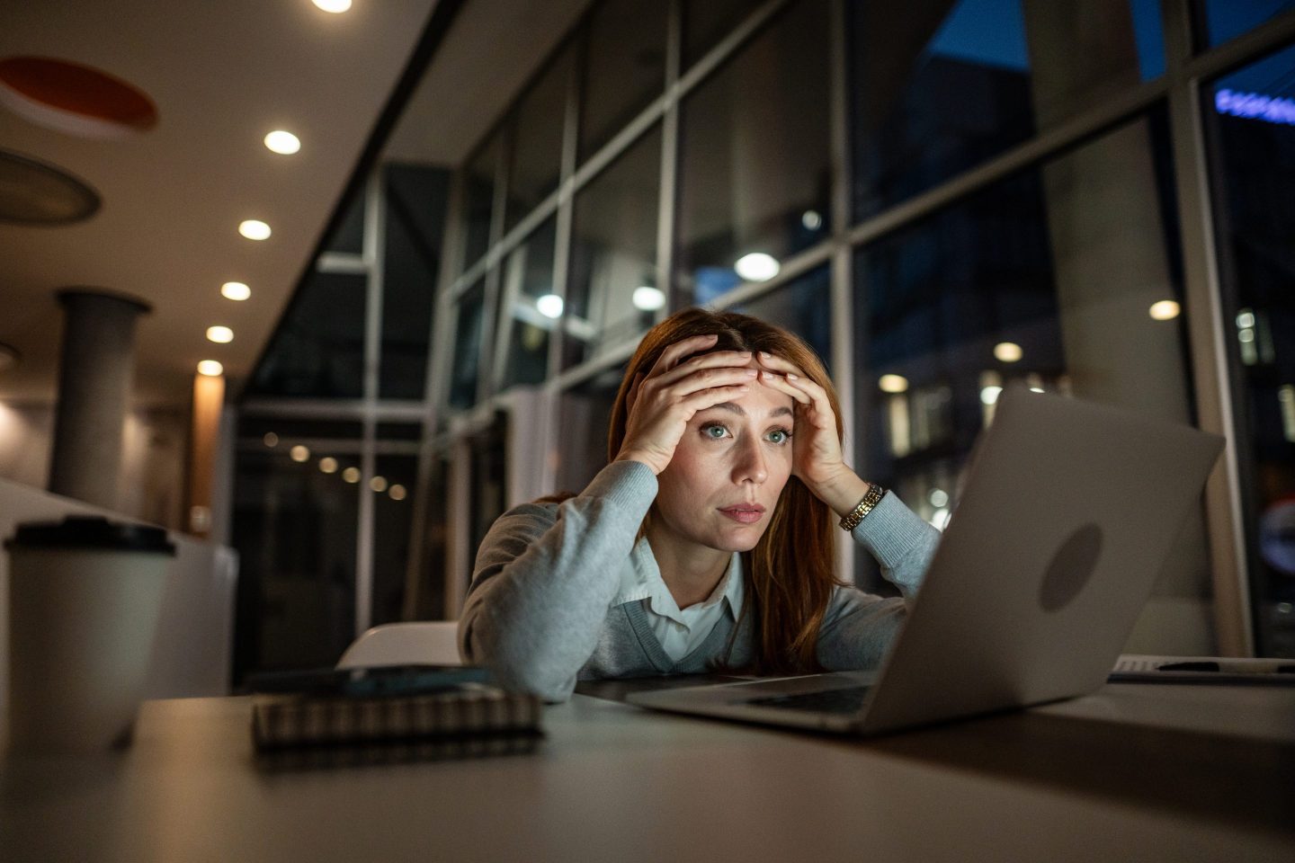 Stressed worker on laptop