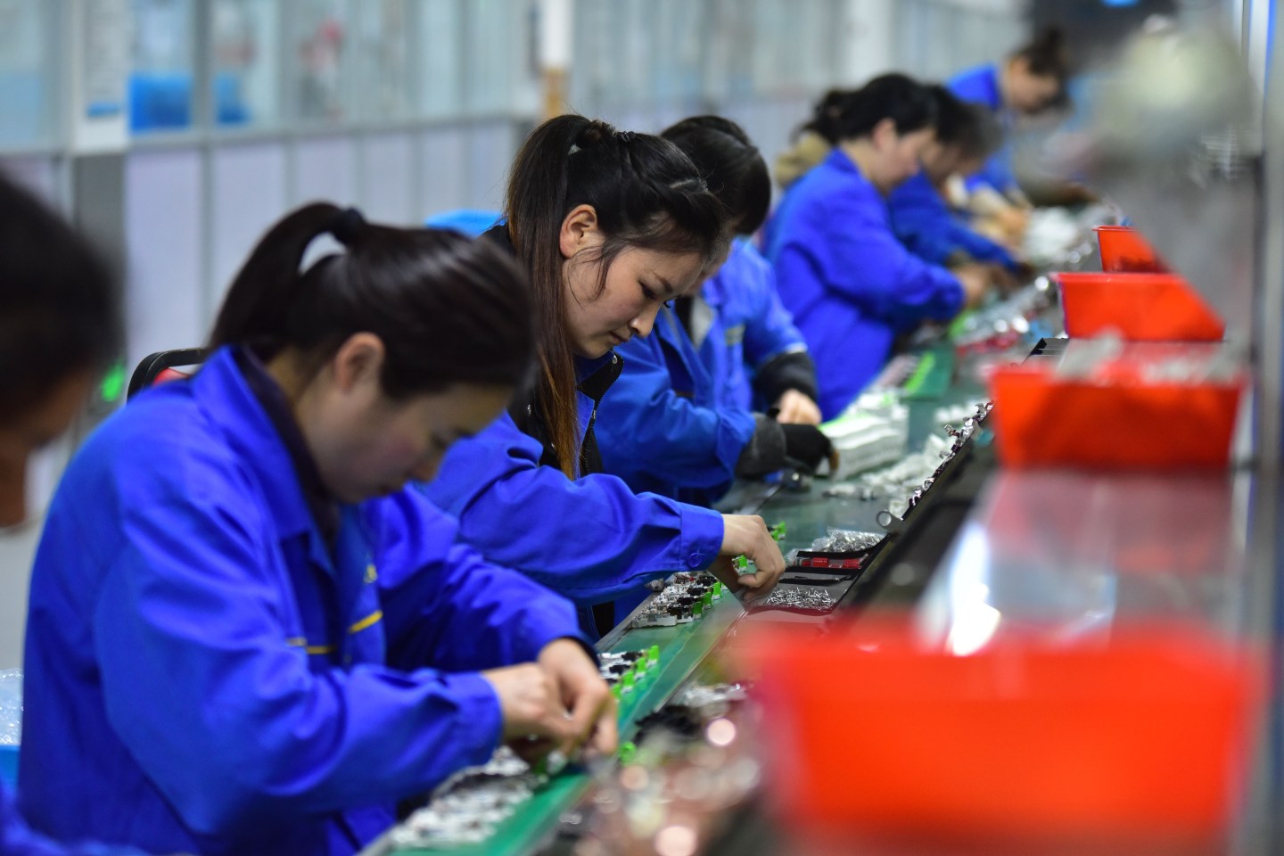 Workers work on a circuit breaker production line at Anhui Wangulian Electric Co., Ltd. in Fuyang City, Anhui Province, China, on March 4, 2026. (Photo by Costfoto/NurPhoto via Getty Images)