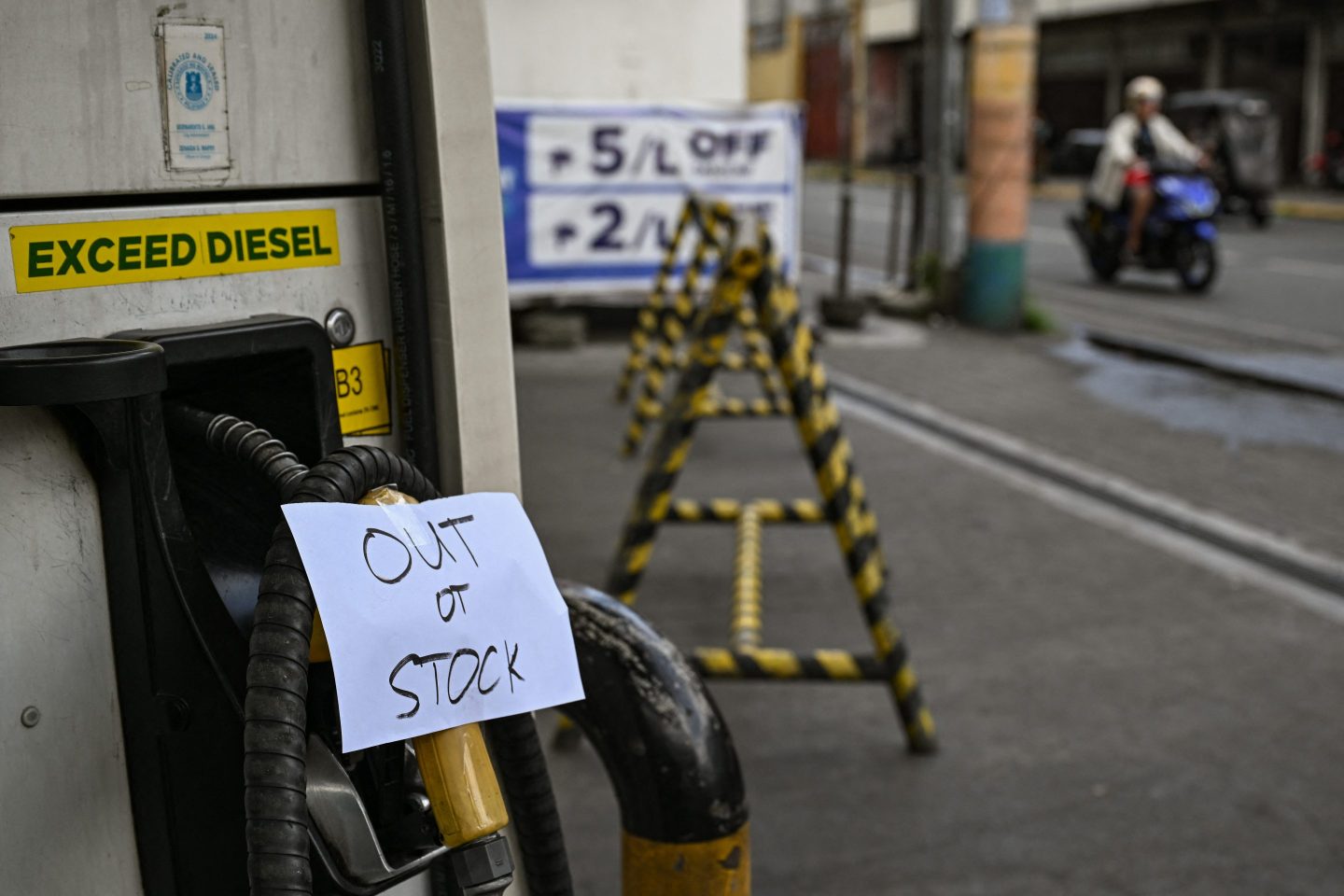 A sign reading 'out of stock' is displayed at a gas station amid rising petrol prices in Manila, the Philippines