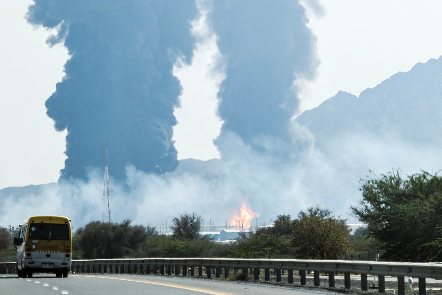 Smoke and flames rise from an energy installation in the Gulf emirate of Fujairah on March 14, 2026. Smoke could be seen rising from the direction of a major UAE energy installation on March 14, in what appeared to be the latest strike targeting the Gulf's petroleum facilities hours after the US struck Iran's Kharg Island. (Photo by AFP via Getty Images) /