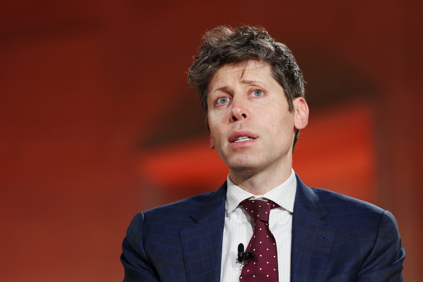 Sam Altman says AI superintelligence is so big that we need a ‘New Deal.’ Critics say OpenAI’s policy ideas are a cover for ‘regulatory nihilism’