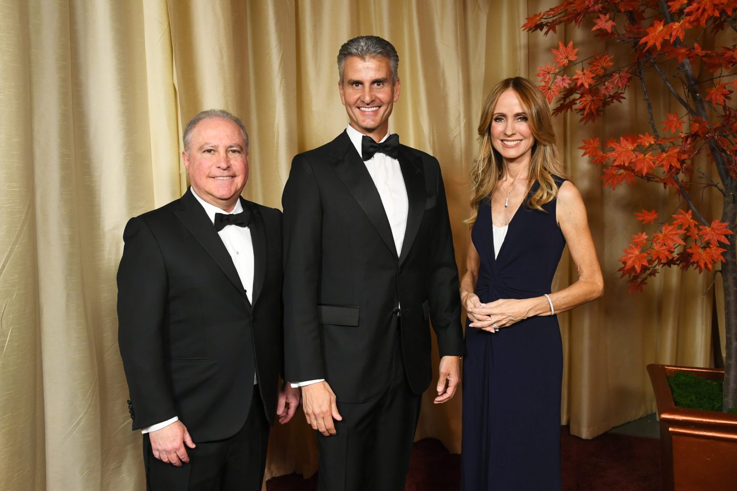 Alan Bergman, Josh D'Amaro and Dana Walden pose