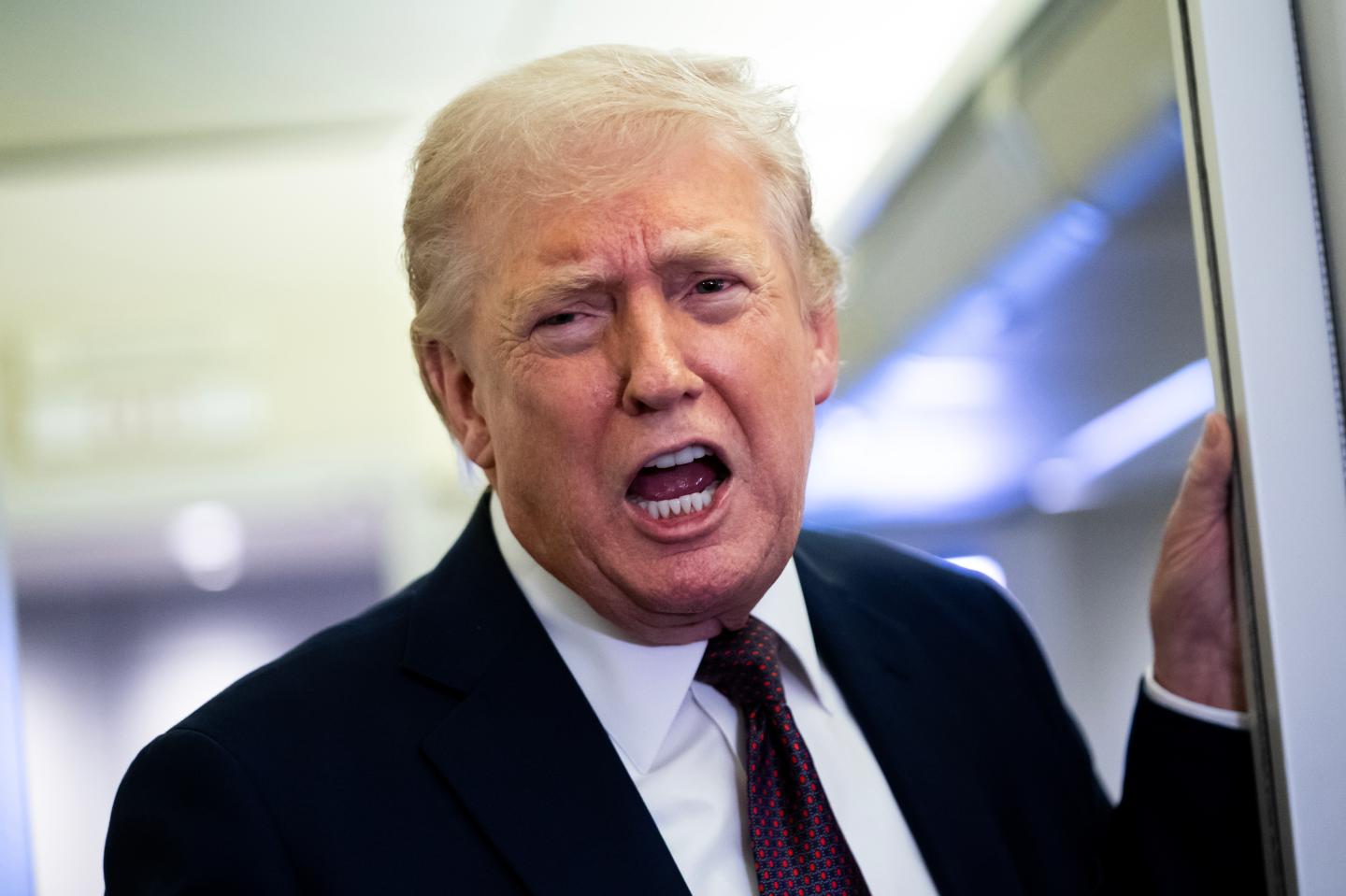 President Donald Trump, his mouth agape on Air Force One.