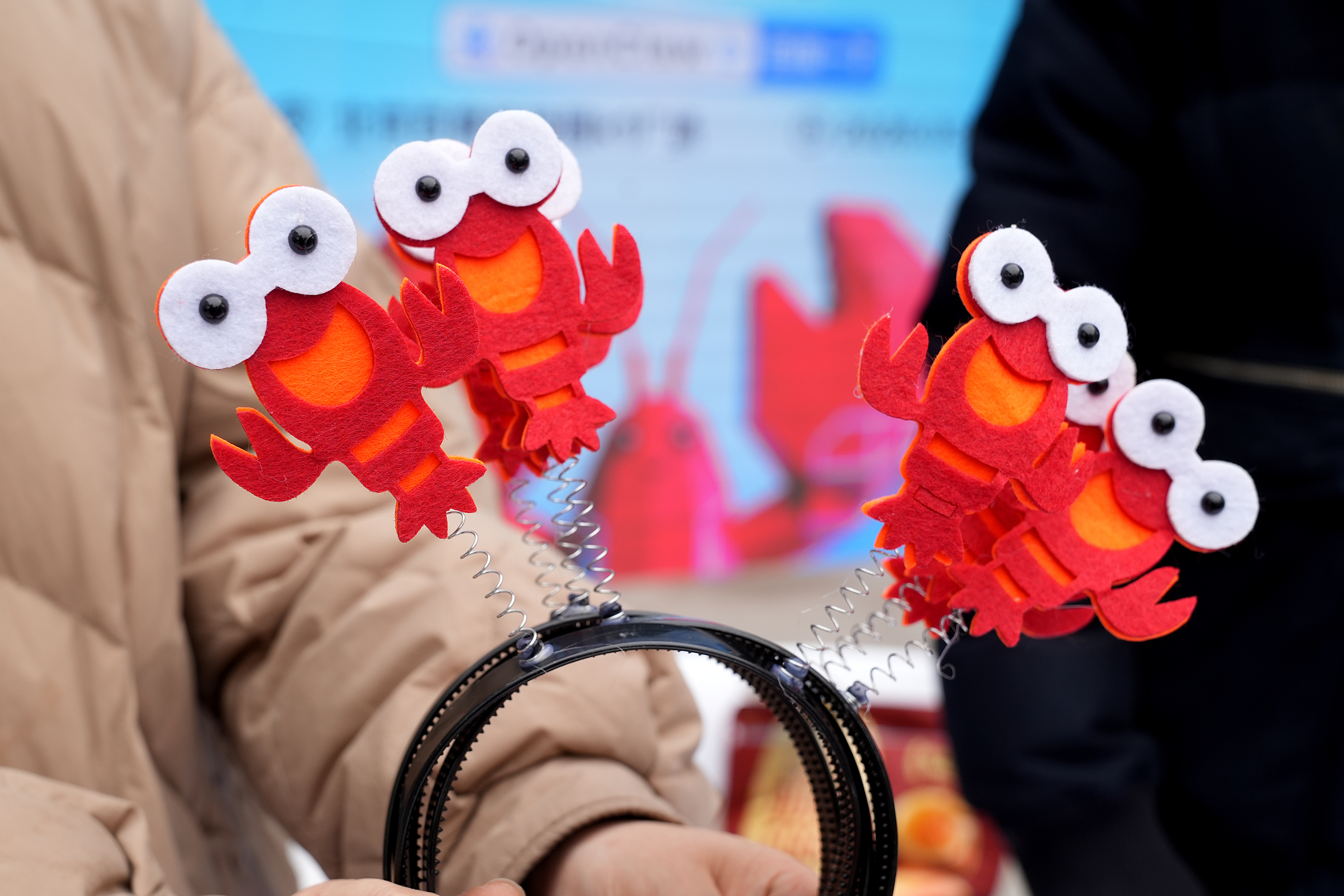 Lobster-themed headbands at Baidu’s OpenClaw Lobster Market event in Beijing, March 17, 2026. 