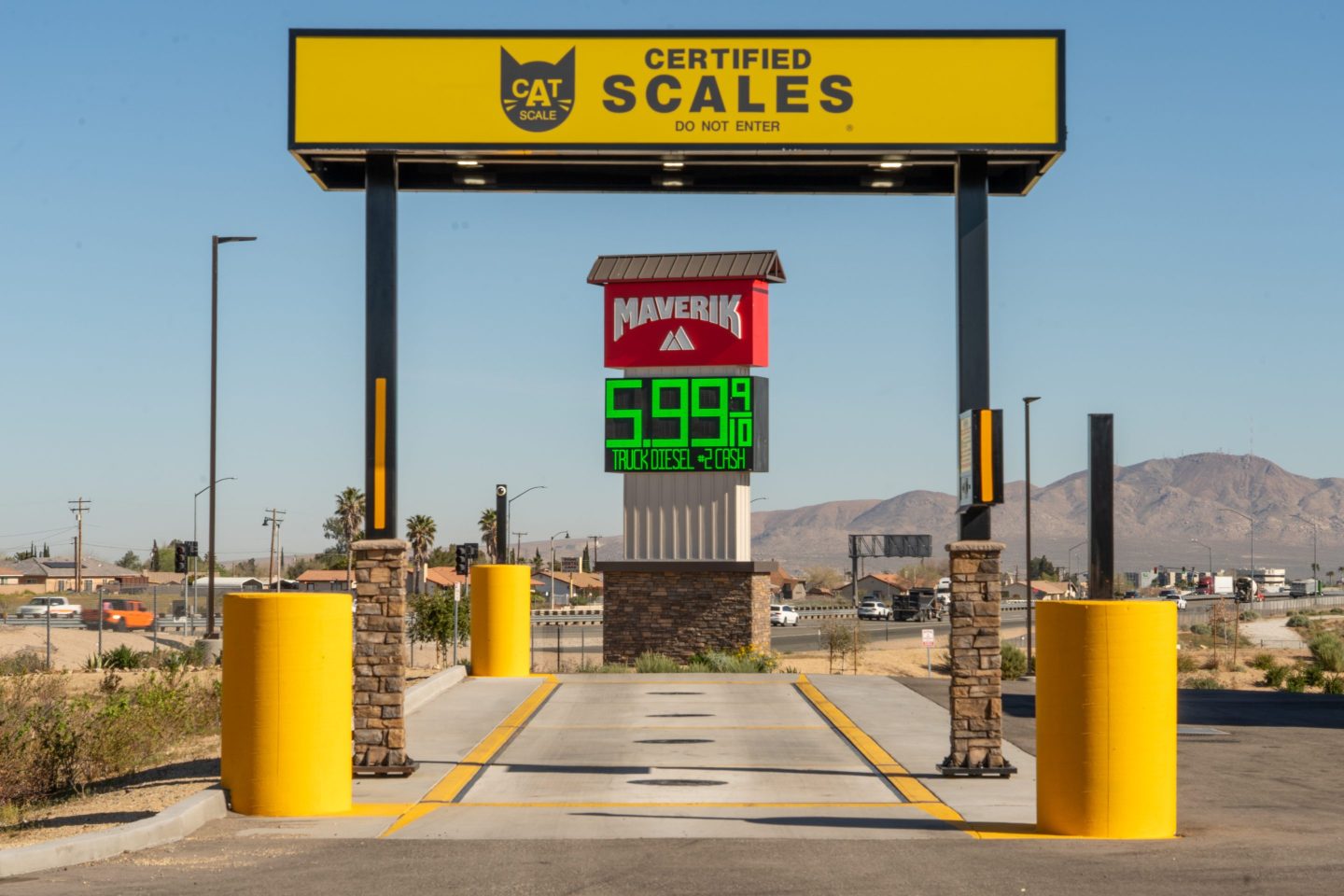 A sign displays the price of diesel fuel, which is at $5.99 at a Maverick gas station