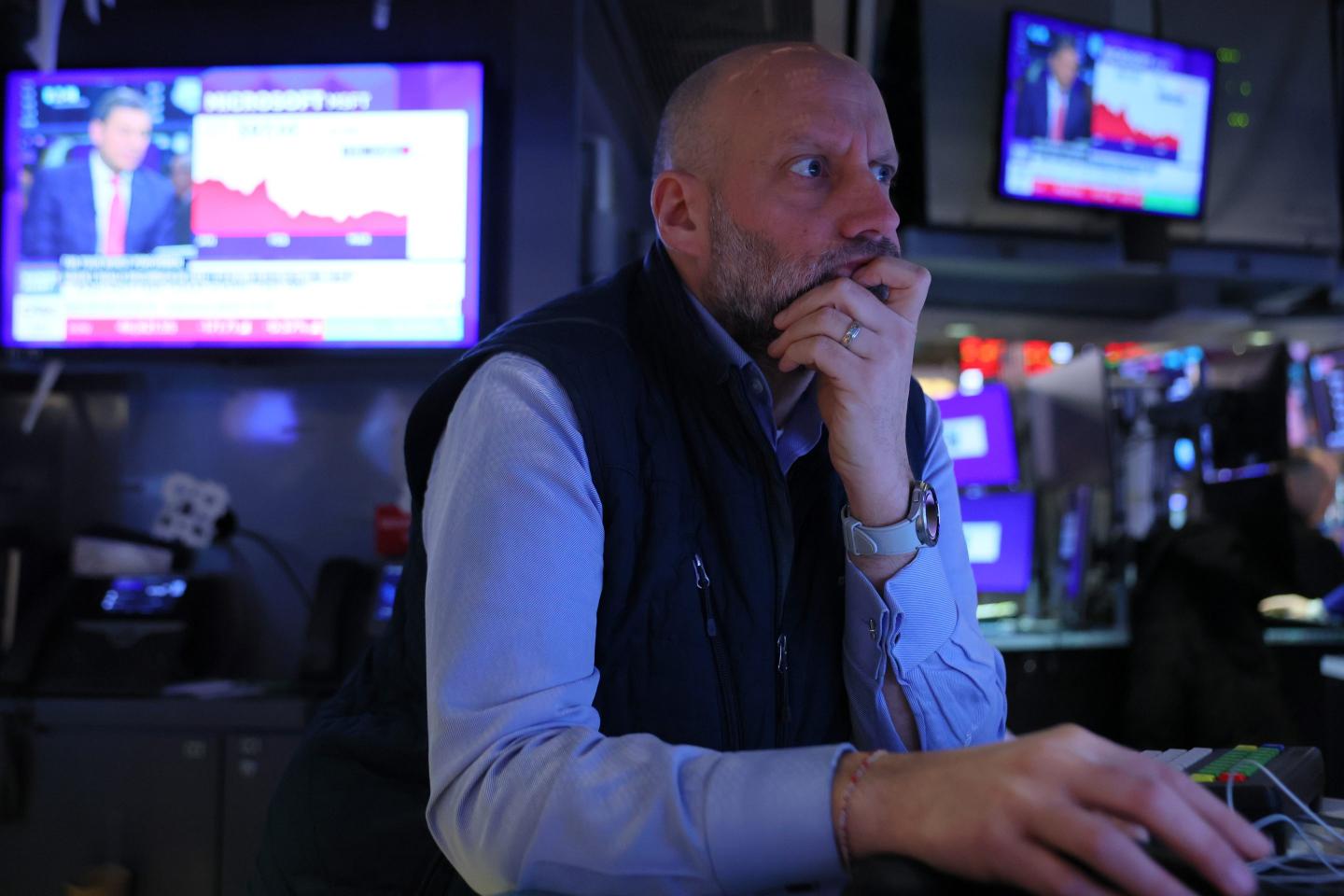 Traders work on the floor of the New York Stock Exchange during morning trading on March 18, 2026 in New York City.