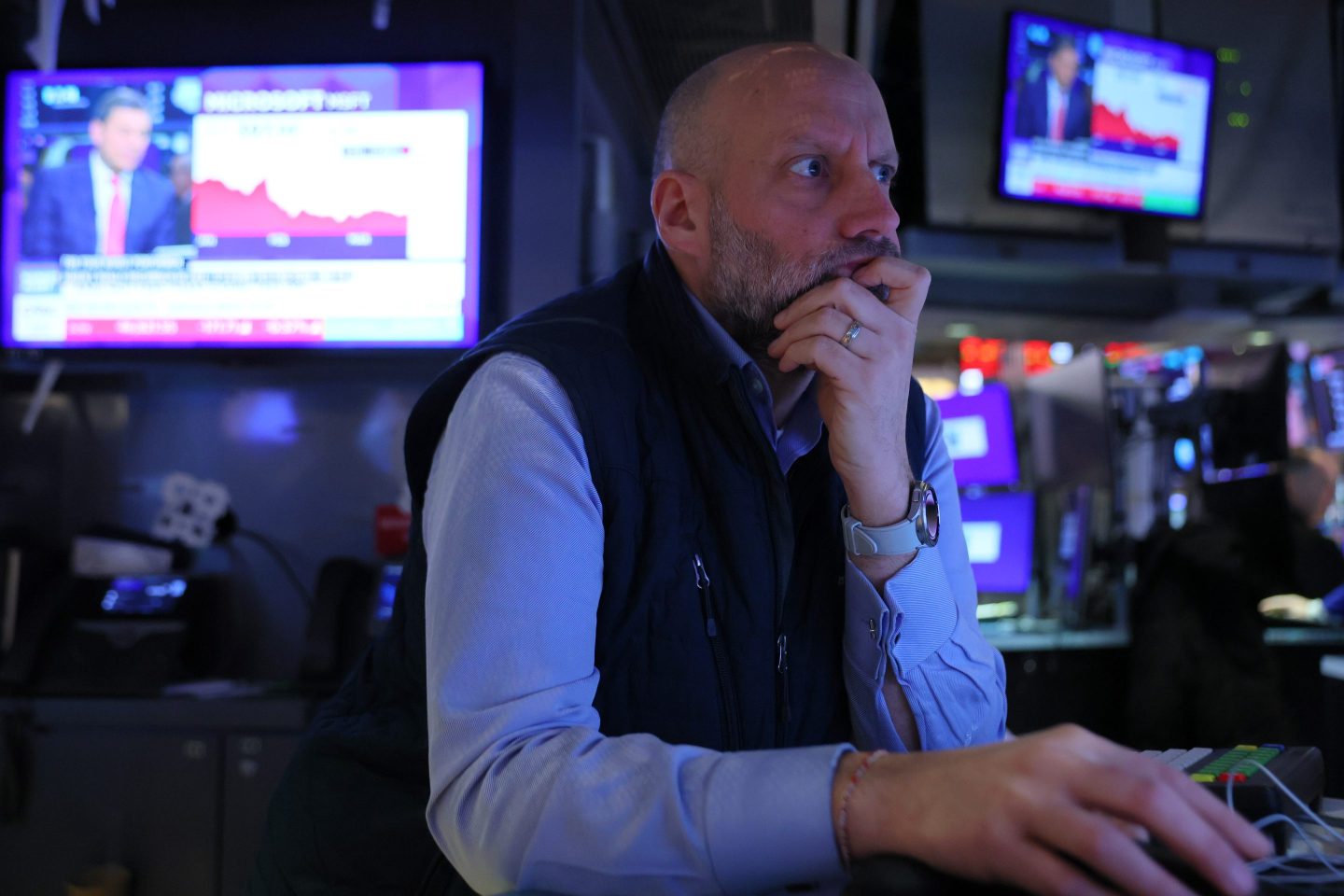 Traders work on the floor of the New York Stock Exchange during morning trading on March 18, 2026 in New York City.