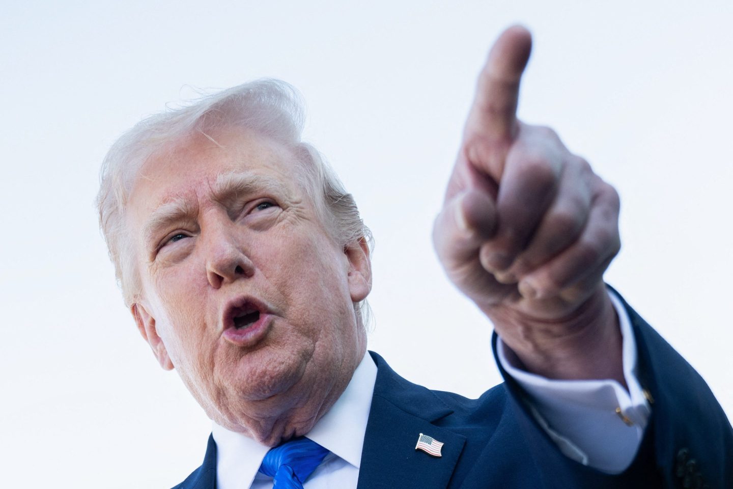 US President Donald Trump speaks to reporters before boarding Air Force One at Palm Beach International Airport in West Palm Beach, Florida, on March 23, 2026.