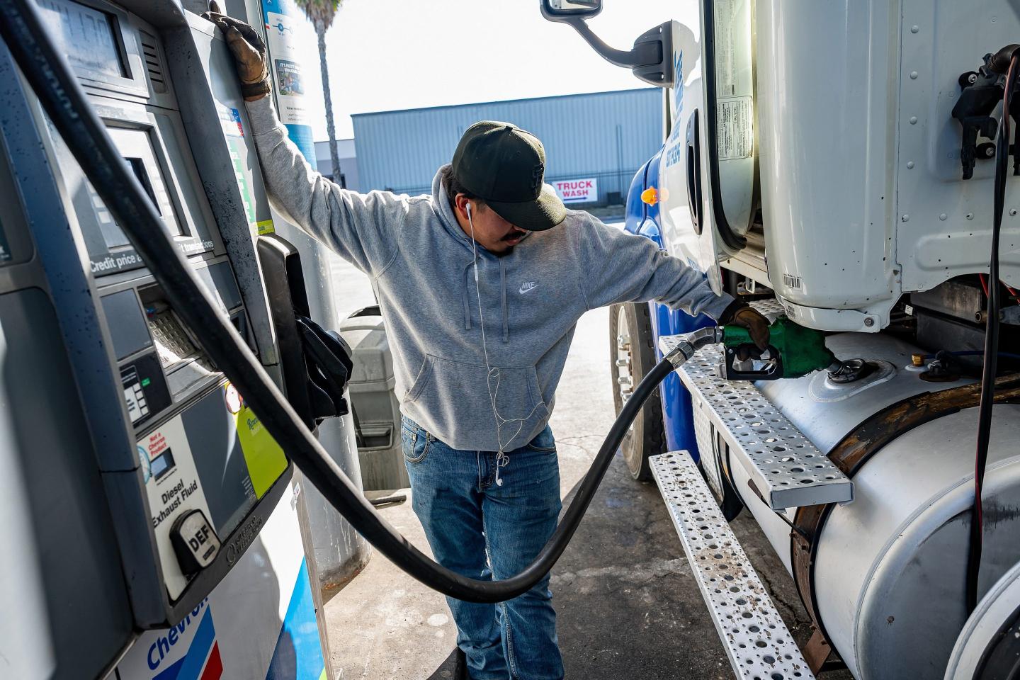 A driver refuels a tractor trailer with diesel at a Chevron in Tracy, Calif., March 25, 2026.
