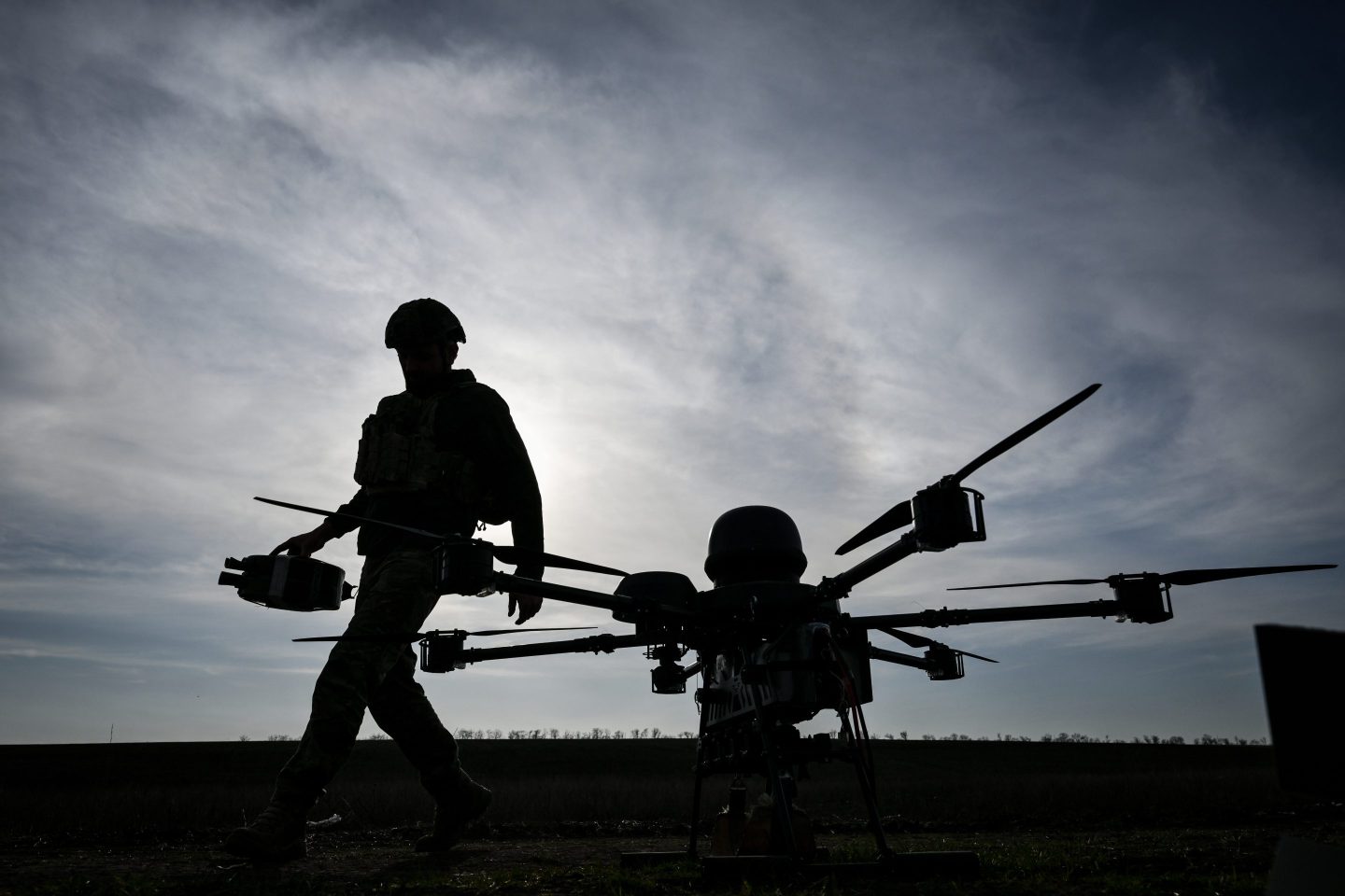 A soldier from a drone unit of Ukraine's 422nd Separate Unmanned Systems Regiment ''Luftwaffe'' prepares a Baba Yaga heavy bomber drone before a daytime training flight in the Zaporizhzhia direction, Ukraine, on March 23, 2026. (Photo by Dmytro Smolienko/Ukrinform/NurPhoto via Getty Images)