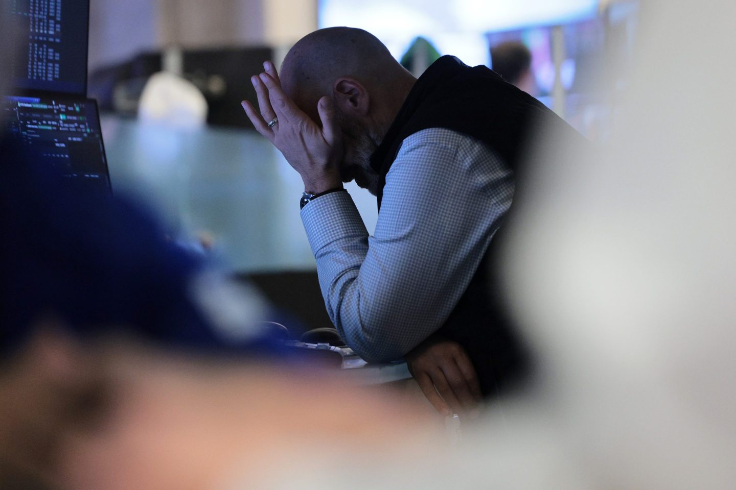 Traders work on the floor of the New York Stock Exchange during morning trading on March 25, 2026 in New York City.