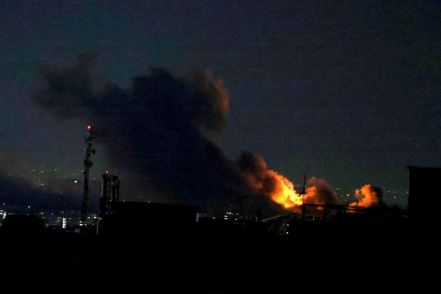 A plume of smoke rises from the site of a strike in Tehran on March 29, 2026.