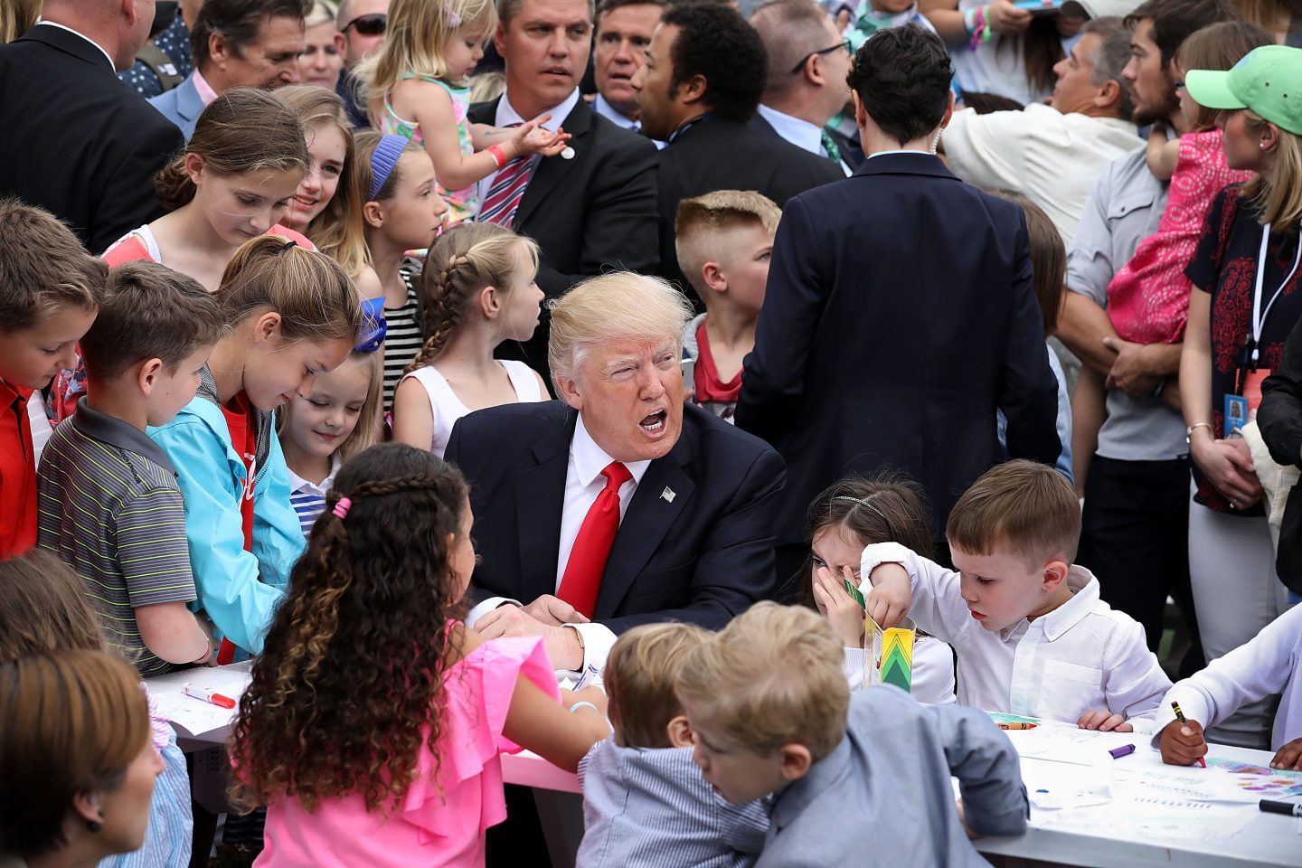 Trump surrounded by children