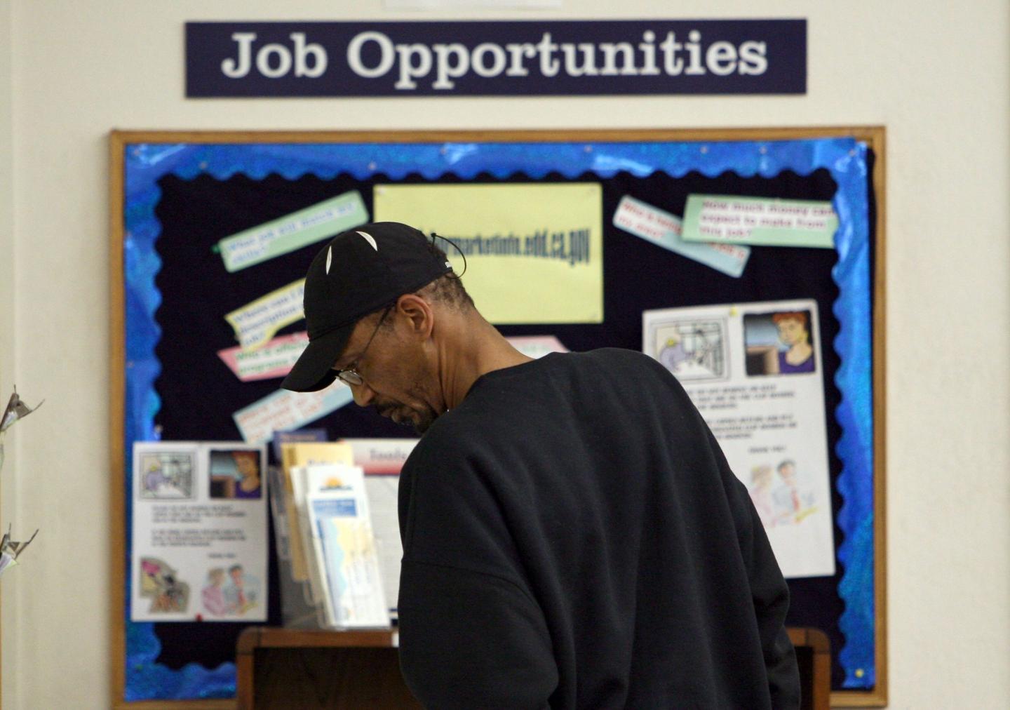 OAKLAND, CA - APRIL 17: A job seeker looks at job listings posted at the East Bay Works One-Stop Career Center April 17, 2009 in Oakland, California. The California state unemployment rate surged to 11.2 percent in March, the highest level since 1941 when unemployment was 11.7 percent. An estimated 2.1 million Californians are out of work. . (Photo by Justin Sullivan/Getty Images)
