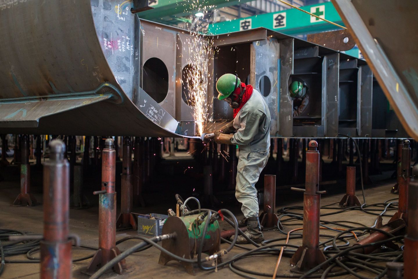 Worker welding on a ship