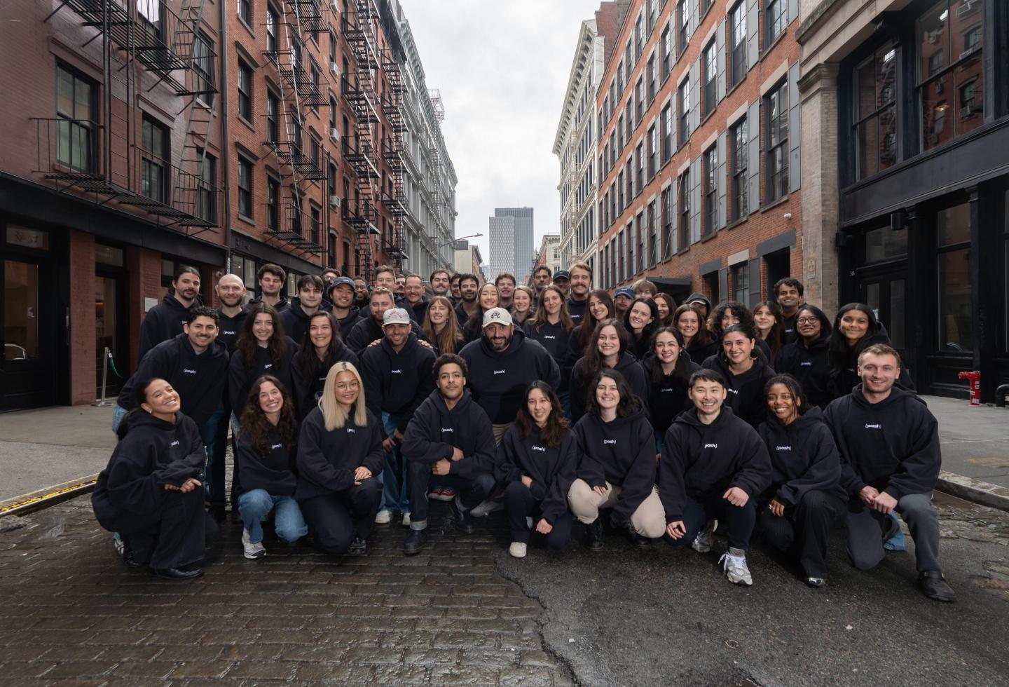 Employees at Posh smile for a photo