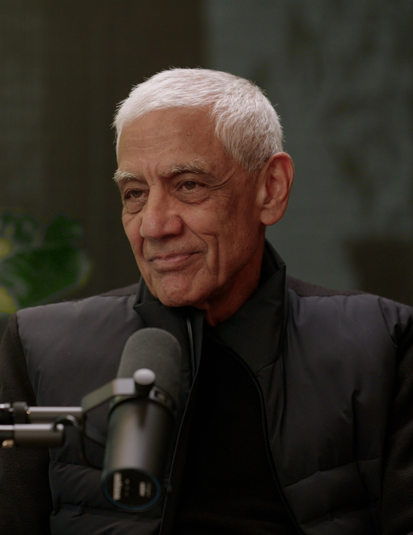 Man stands in front of microphone