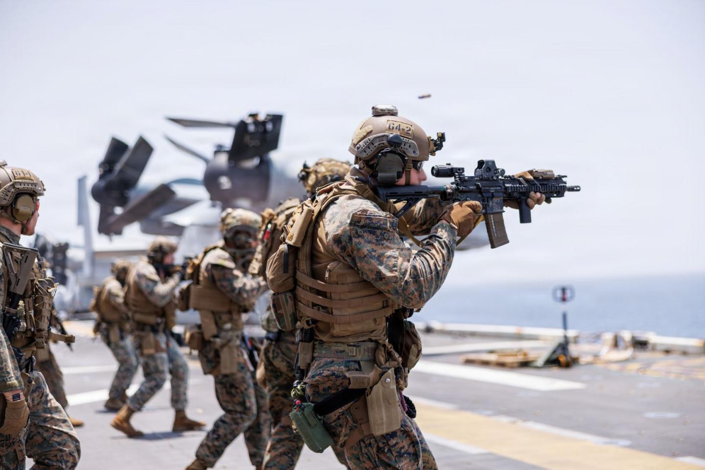 Marines fire rifles during a deck shoot aboard the forward-deployed amphibious assault ship U.S.S. Tripoli (LHA 7), in the U.S. Central Command area of responsibility during Operation Epic Fury, April 2, 2026.