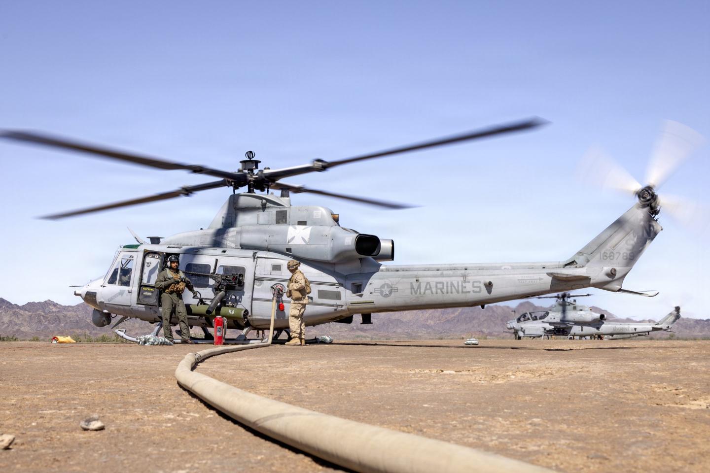 Marines assigned to Marine Aviation Weapons and Tactics Squadron One  (MAWTS-1) refuel an UH-1Y Venom helicopter assigned to MAWTS-1 during a Forward Arming and Refueling Point OIC course as part of Weapons and Tactics Instructor course  2-26, at Landing Zone Bull Attack, near Chocolate Mountains, California, April 1, 2026. 