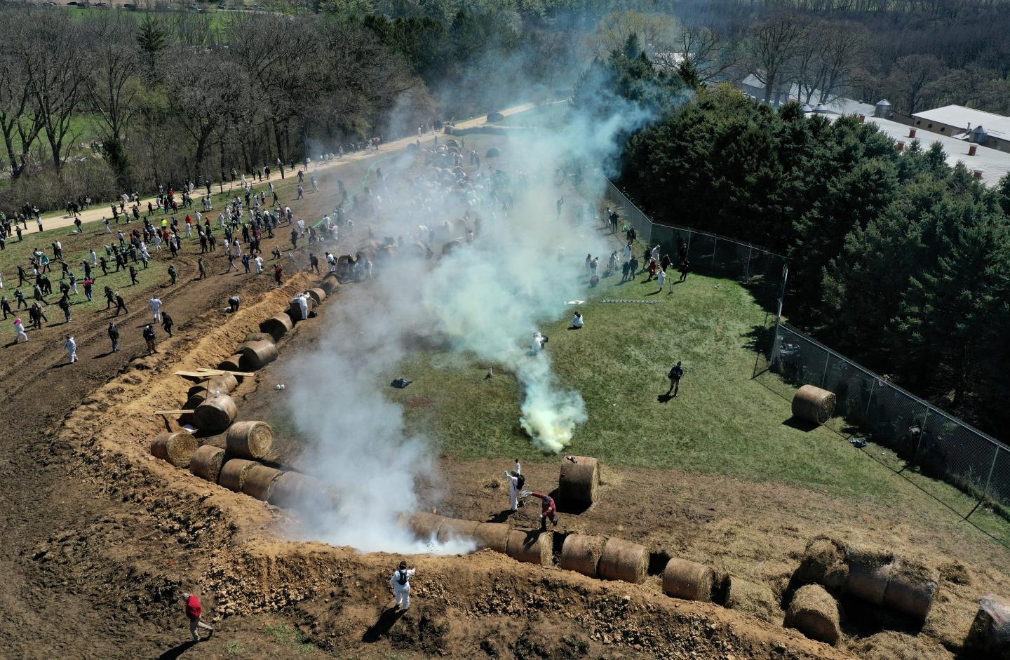 About 1,000 animal welfare activists tried to storm a beagle research facility protected by a manure-filled trench, hay bales and a barbed-wire fence