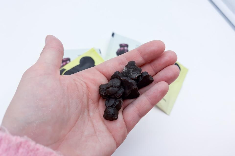 An eight-piece Nutrops gummy snack resting in someone's open palm.