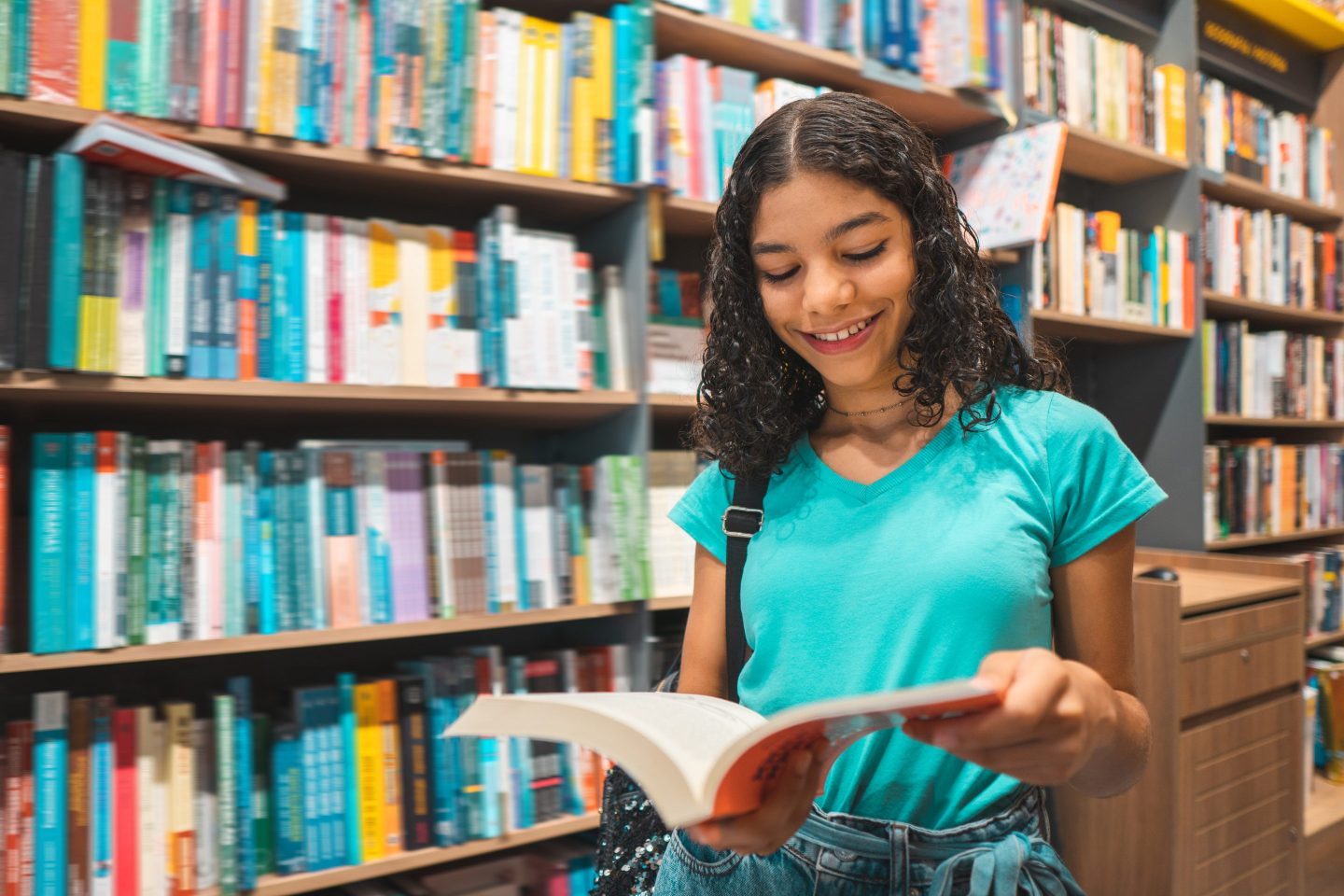 Girl reading in a library