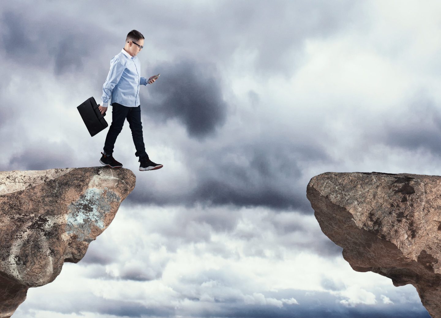 Walking into the abyss while using smartphone.