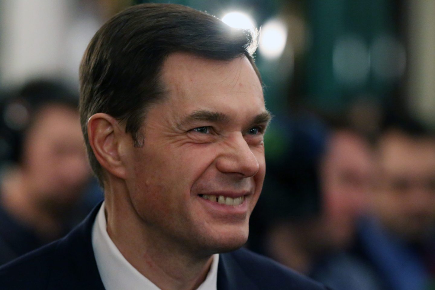 Alexei Mordashov looks forward and smiles.