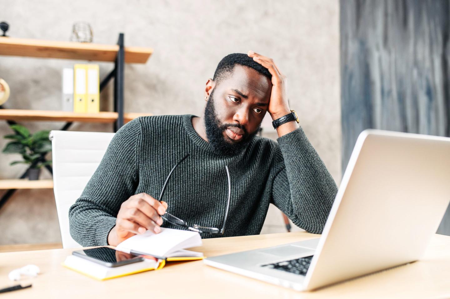 Frustrated job seeker on laptop