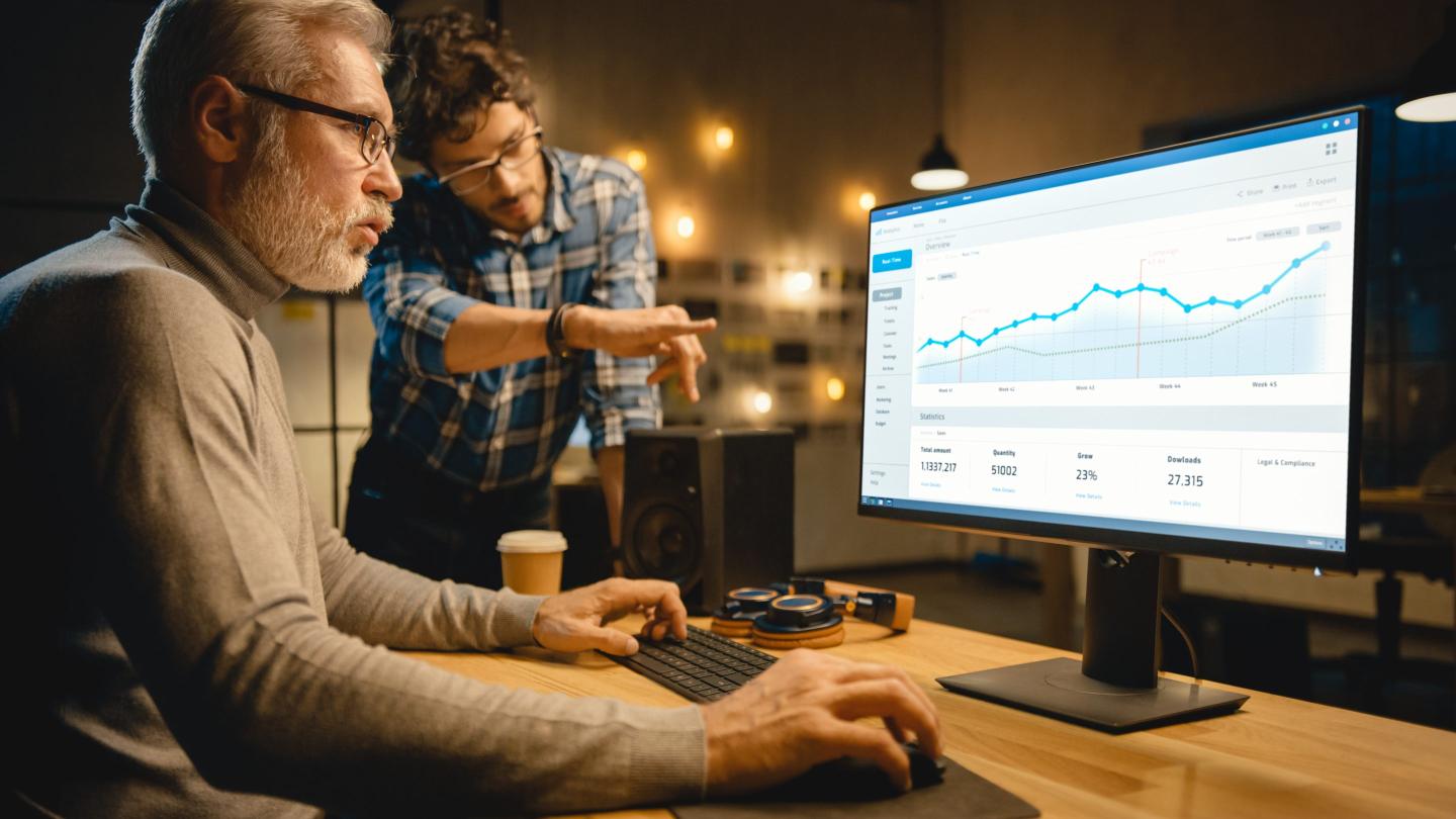 Financial analyst working at a computer