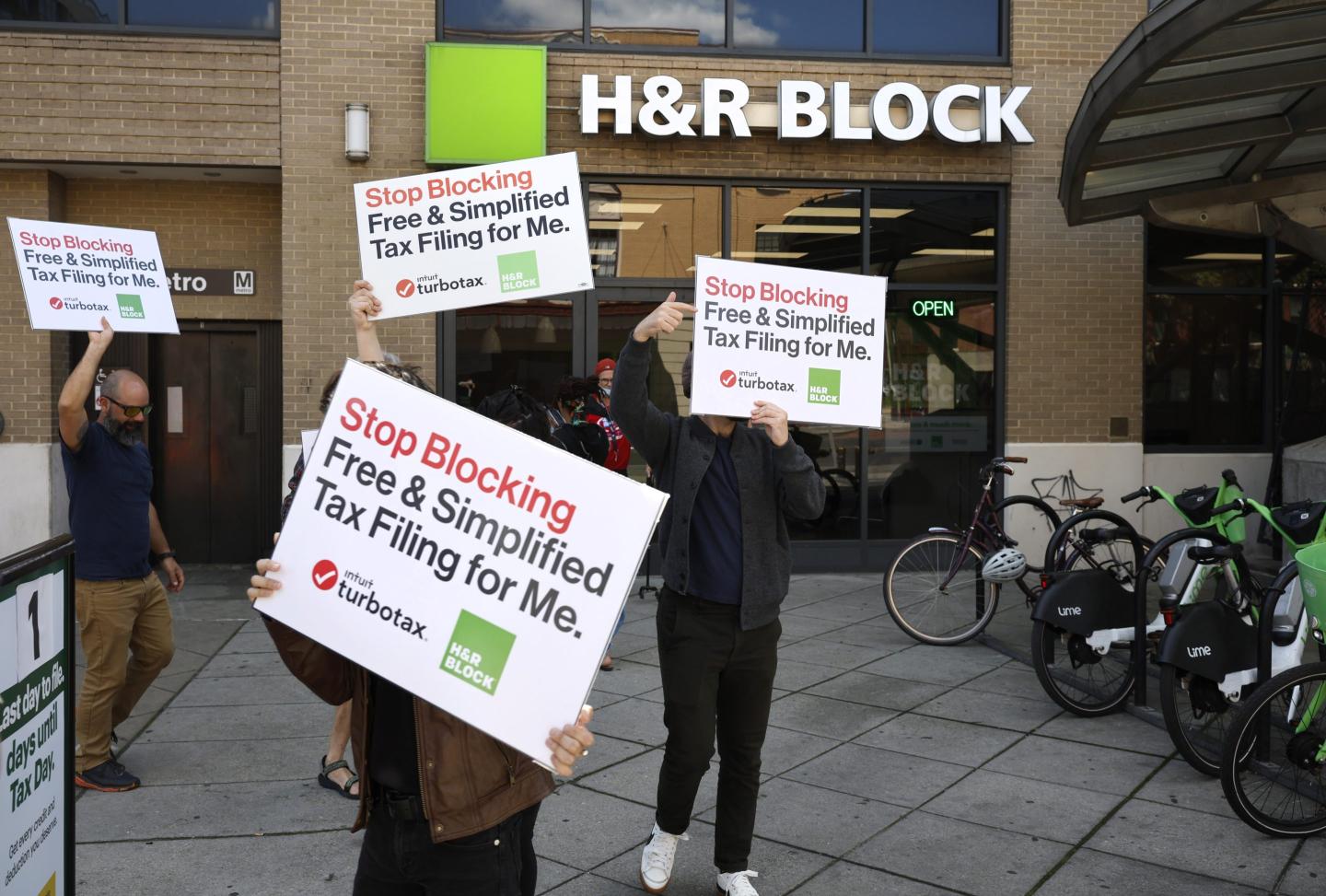People protesting against tax giants.