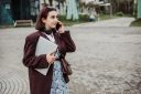 Young woman talking on her phone while walking