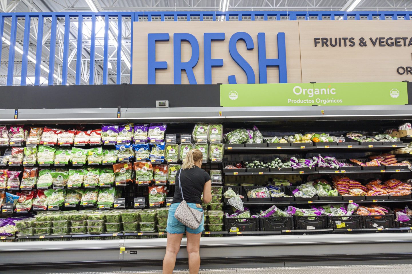 A woman shops in the produce aisle
