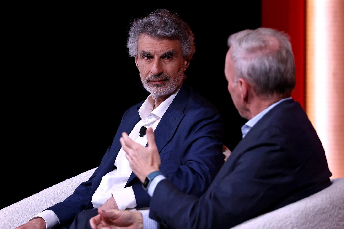 Yoshua Bengio seated on a stage.