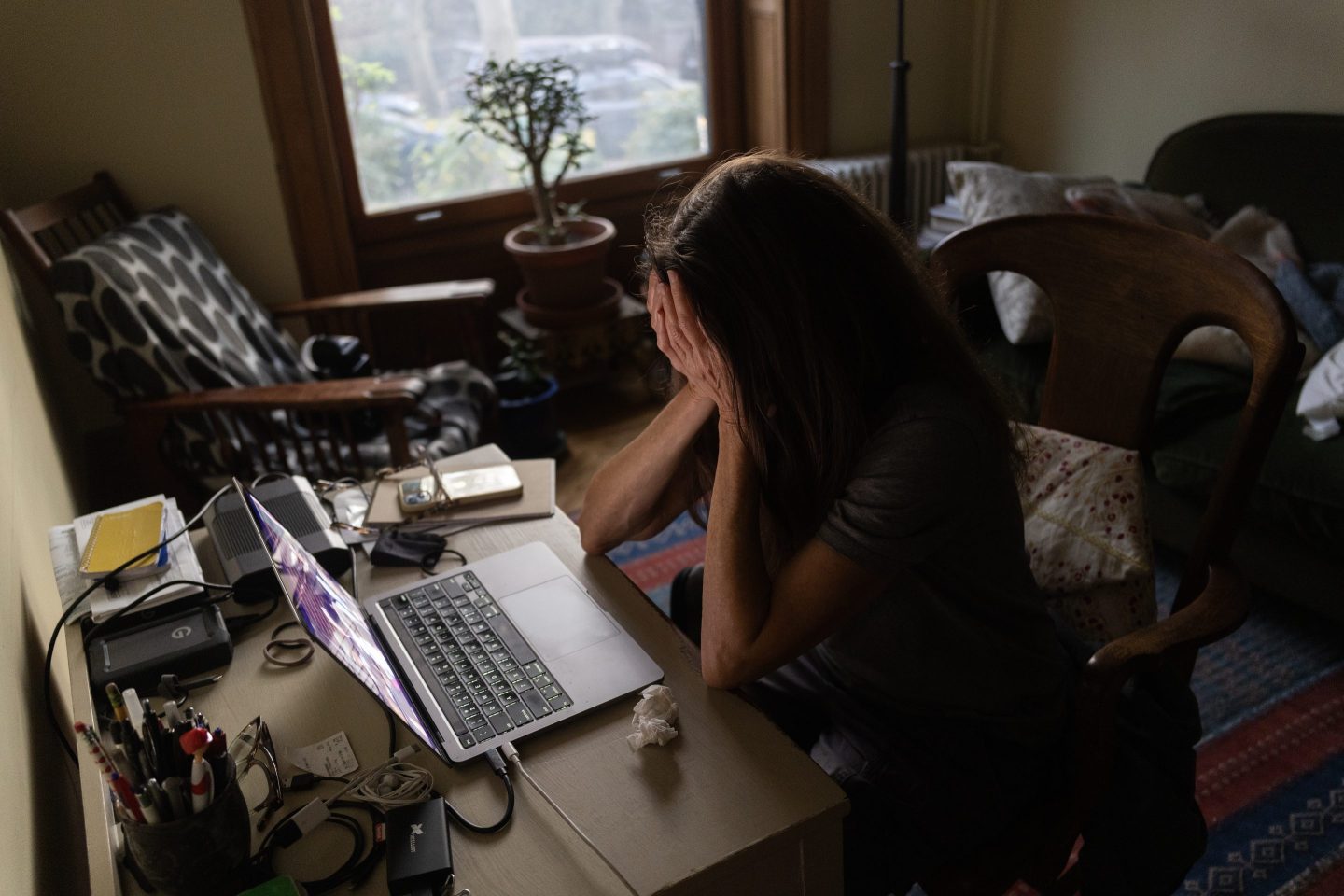 Woman tired while looking at computer