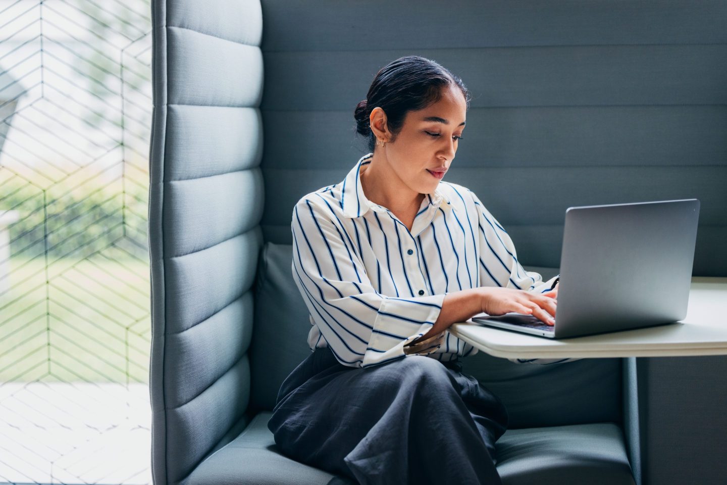 woman typing on a computer.