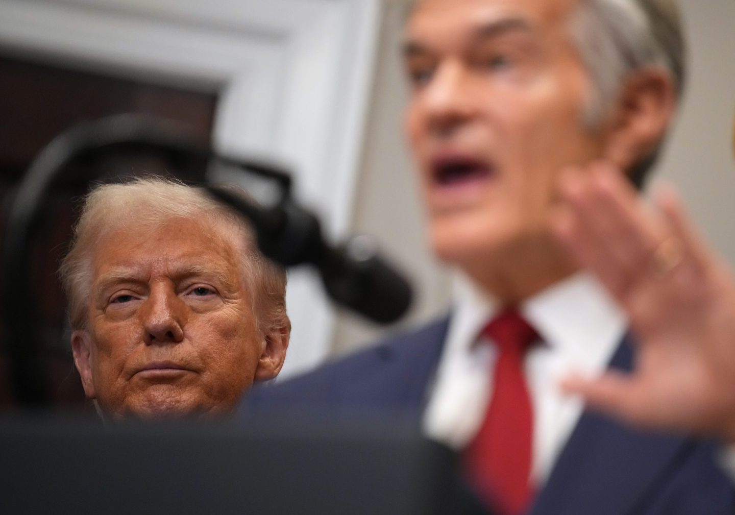 Dr. Oz and Trump at podium